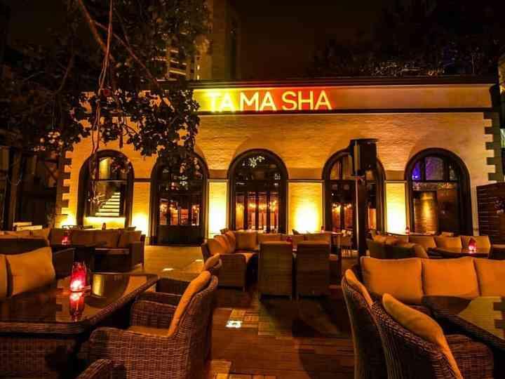 "tamasha bar with outdoor seating area.">