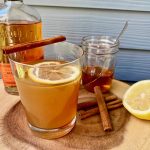 "Toddy drink with lemon and glasses to enjoy">