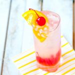 "tom collins drink with cherry and lemon">