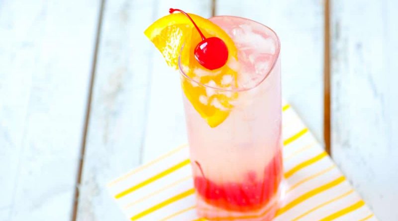 "tom collins drink with cherry and lemon">