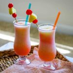 "Frozen bahama mama cocktail with straws">