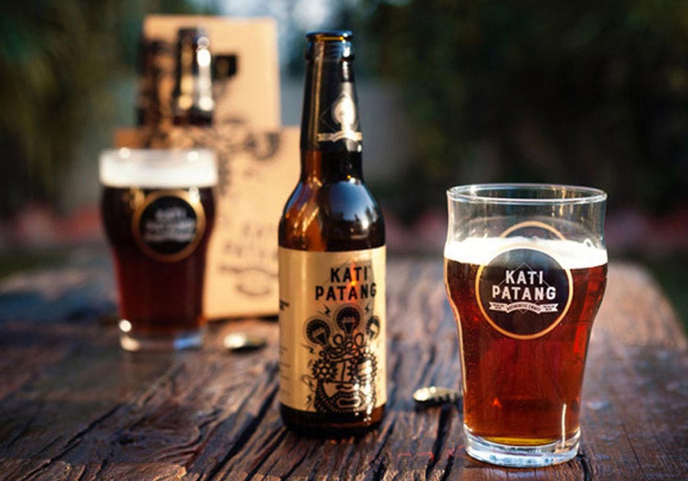 "Kati Patang beer with a glass.">