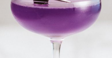 "Aviation cocktail with cherry topping.">
