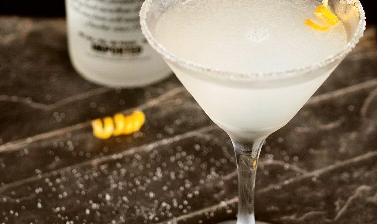 "Lemon drop martini cocktail with lemon zest.">